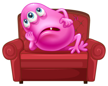 A couch with a pink monster