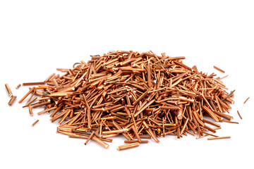 Copper wire is cut into pieces isolated on white background.