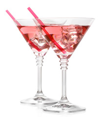 Red cocktail in martini glasses isolated on white