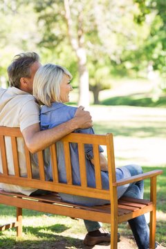 Couple relaxing on park bench