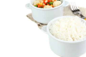 Cooked rice and vegetables isolated on white