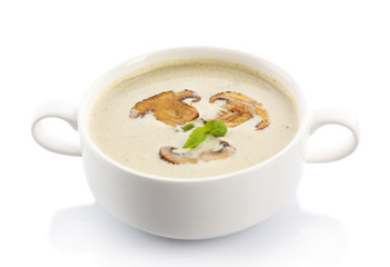 Mushroom soup in white bowl,, on plate, isolated on white