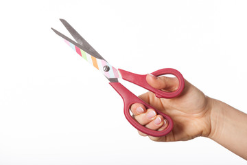 Hand with colorful scissors