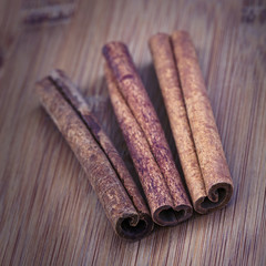 Cinnamon sticks on a wooden surface