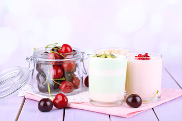 Delicious yogurt with fruits tastes in glasses and fresh fruits