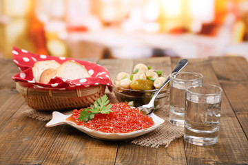 Composition with glass of vodka and marinated mushrooms,