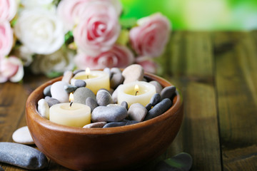 Composition with spa stones, candles  and flowers
