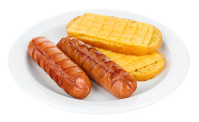 Grilled sausages with toasts isolated on white