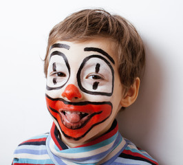 little cute boy with facepaint like clown, pantomimic expression
