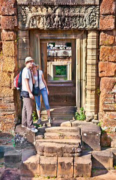 Couple at door of Prasat Pre Roup temple, Cambodia.