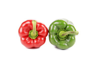Two red and green peppers close up.
