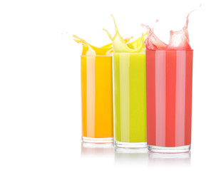 tasty summer fruit drinks in glass with splash
