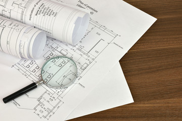 Construction drawings and magnifying glass
