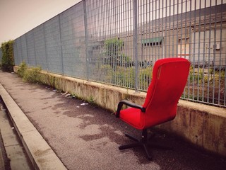 Lonely red chair in suburbia