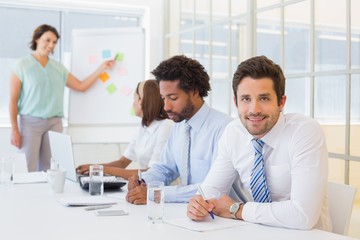 Businessman with colleagues in boardroom meeting