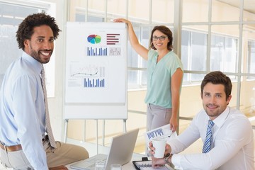 Fototapeta premium Businesswoman giving presentation to colleagues in office
