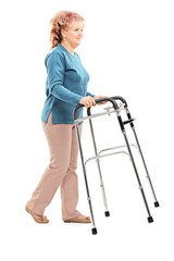 Mature woman walking with walker