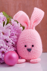 handmade easter bunny with colorful flowers and easter eggs