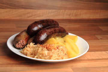 czech food - black and white pudding with potatoes and sauerkrau
