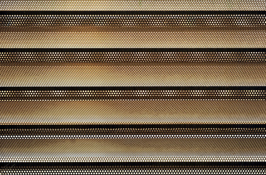 Perforated and folded sheet, building material