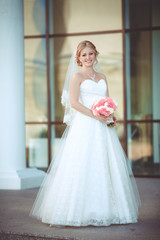Naklejka premium Beautiful Bride in wedding day outdoors