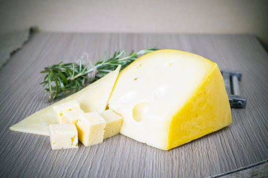 Cheese on Wooden Background