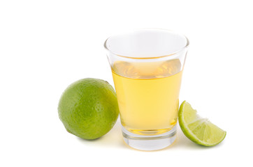 Gold tequila shot with lemon