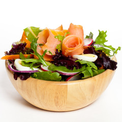 Smoked salmon salad with red onion, egg, carrots and radishes