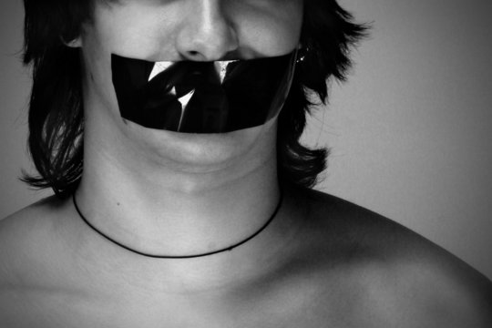 The young man with duct tape over his mouth
