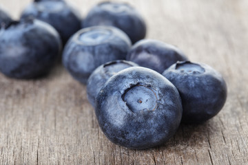ripe blueberries on wooden table