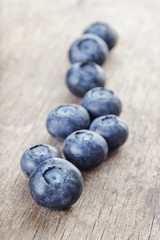 ripe blueberries on wooden table