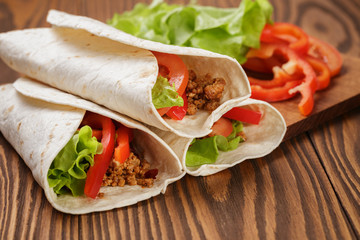 burrito with meat and ingredients