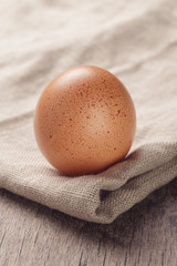 speckled chicken egg or old table