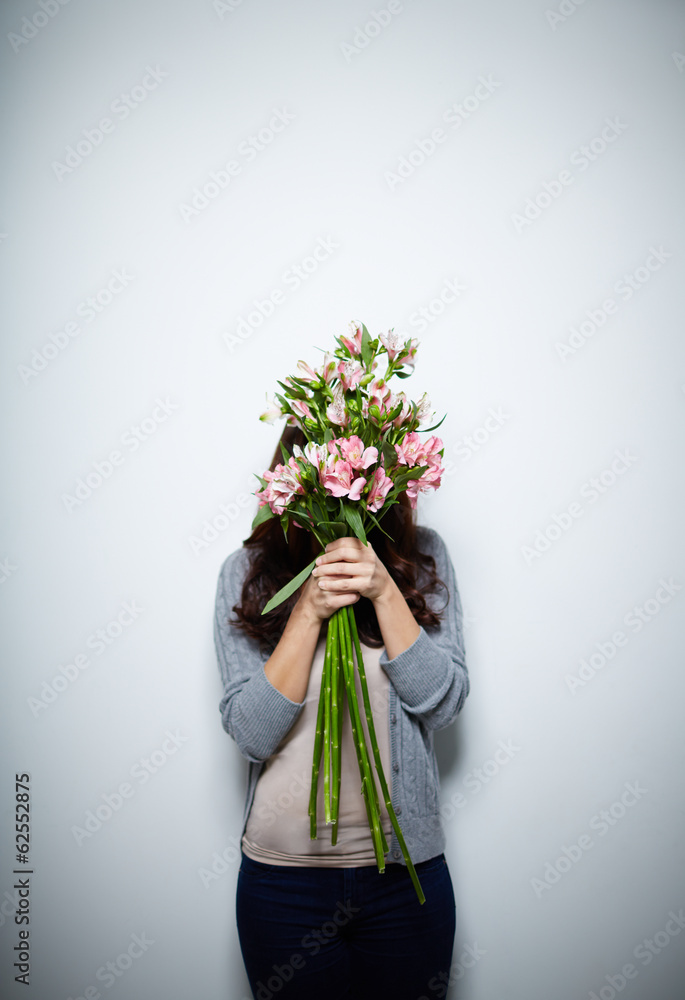 Poster hiding behind flowers