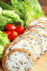 bread sprinkled with sesame -  vegetable green salad