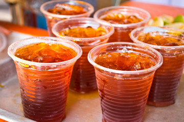 Soft drinks in plastic cups - 62553417