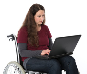 woman in wheelchair working with the computer