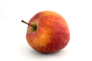 Ripe juicy apple on a white background