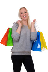 Fototapeta na wymiar Junge Blondine beim Shopping mit Einkaufstaschen