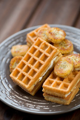 Vertical shot of freshly made waffles served with fried banana