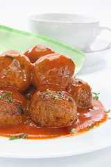 Fried pork meatballs with tomato sauce