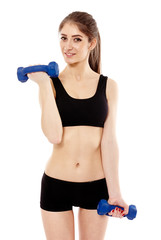 Woman working with dumbbells
