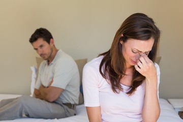 Couple not talking after an argument in bed