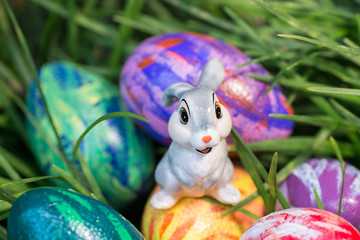 Bunny sitting on top of an Easter egg close-up