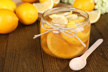 Tasty lemon jam on table close-up