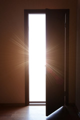 Open door with bright light outside