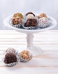 Set of chocolate candies on table on light background