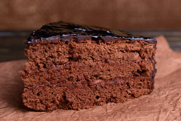 Delicious chocolate cake on table close-up