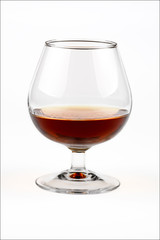 glass with cognac on a white background