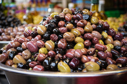Selection of olives in a bowl for sale at a market